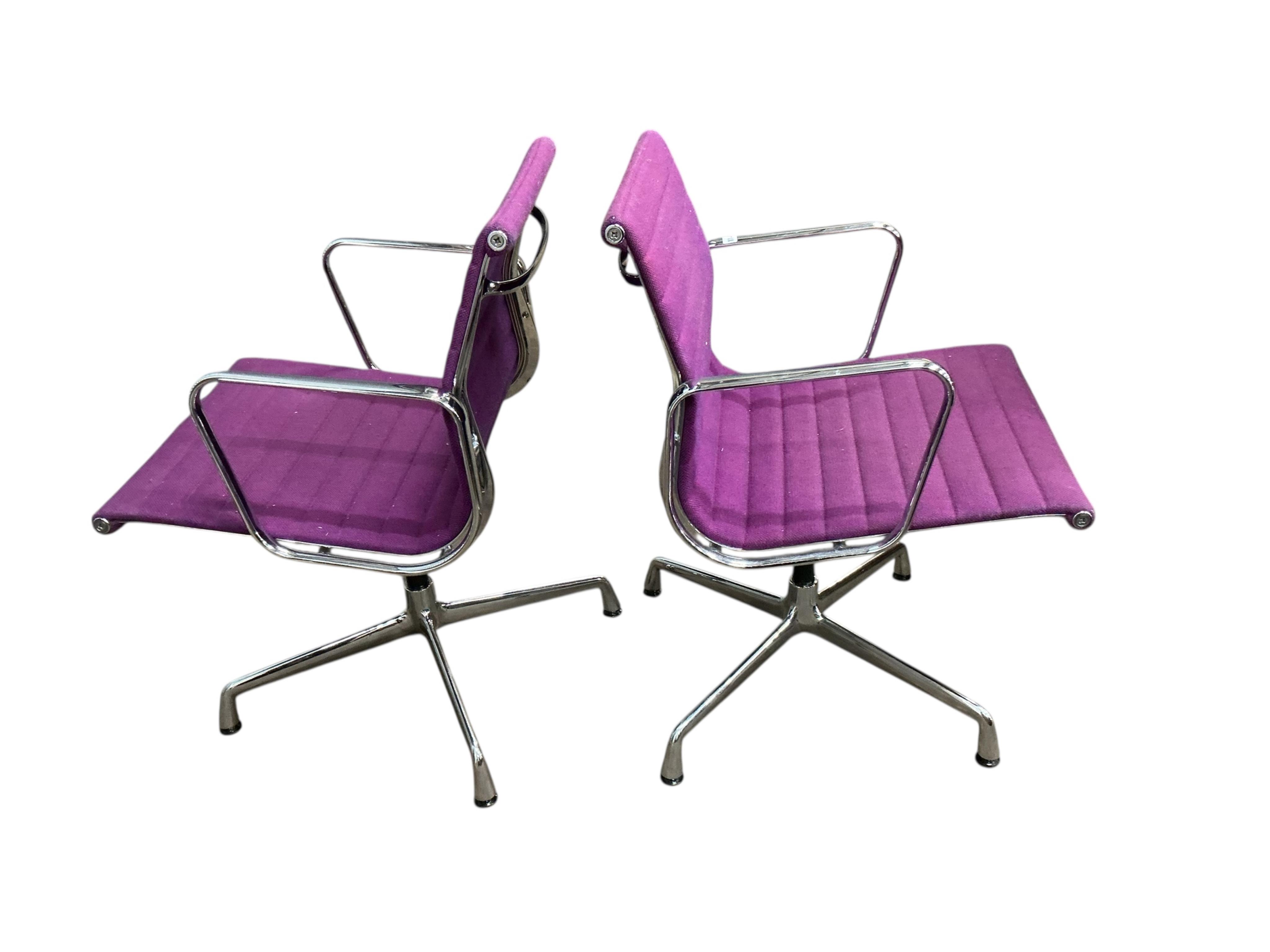 Charles Eames for Vitra, a pair of chrome swivel desk chairs on four prong bases, width 57cm, depth 50cm, height 82cm